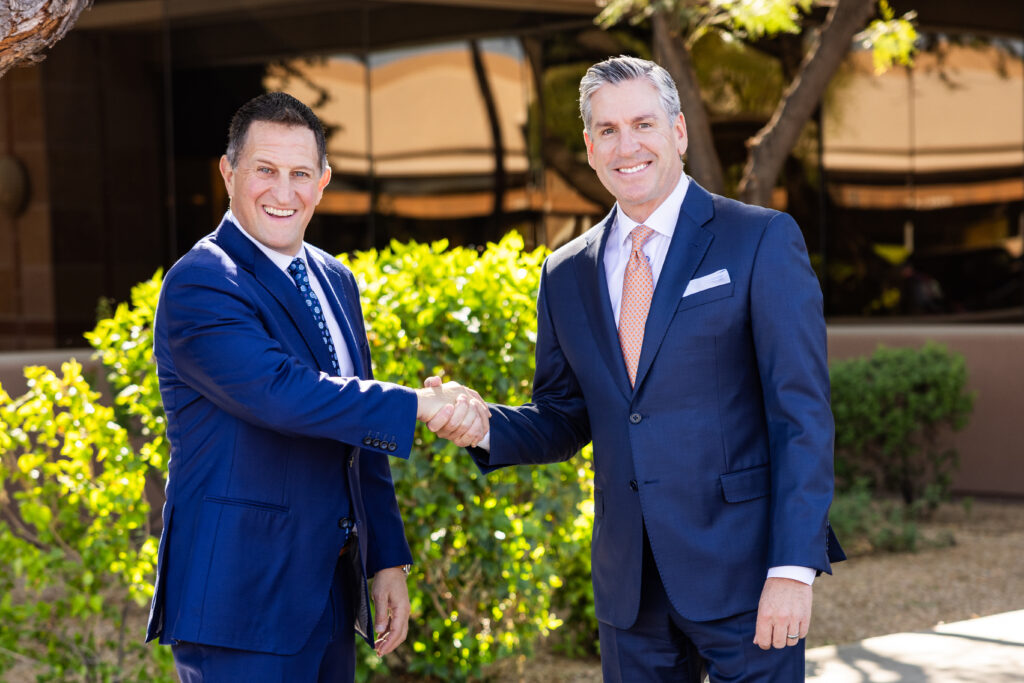 Stu and Mark shaking hands